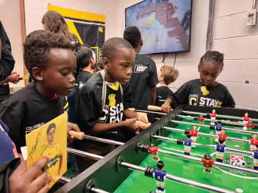 students playing foosball